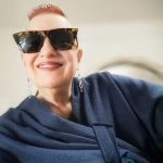 laura wearing blue cape