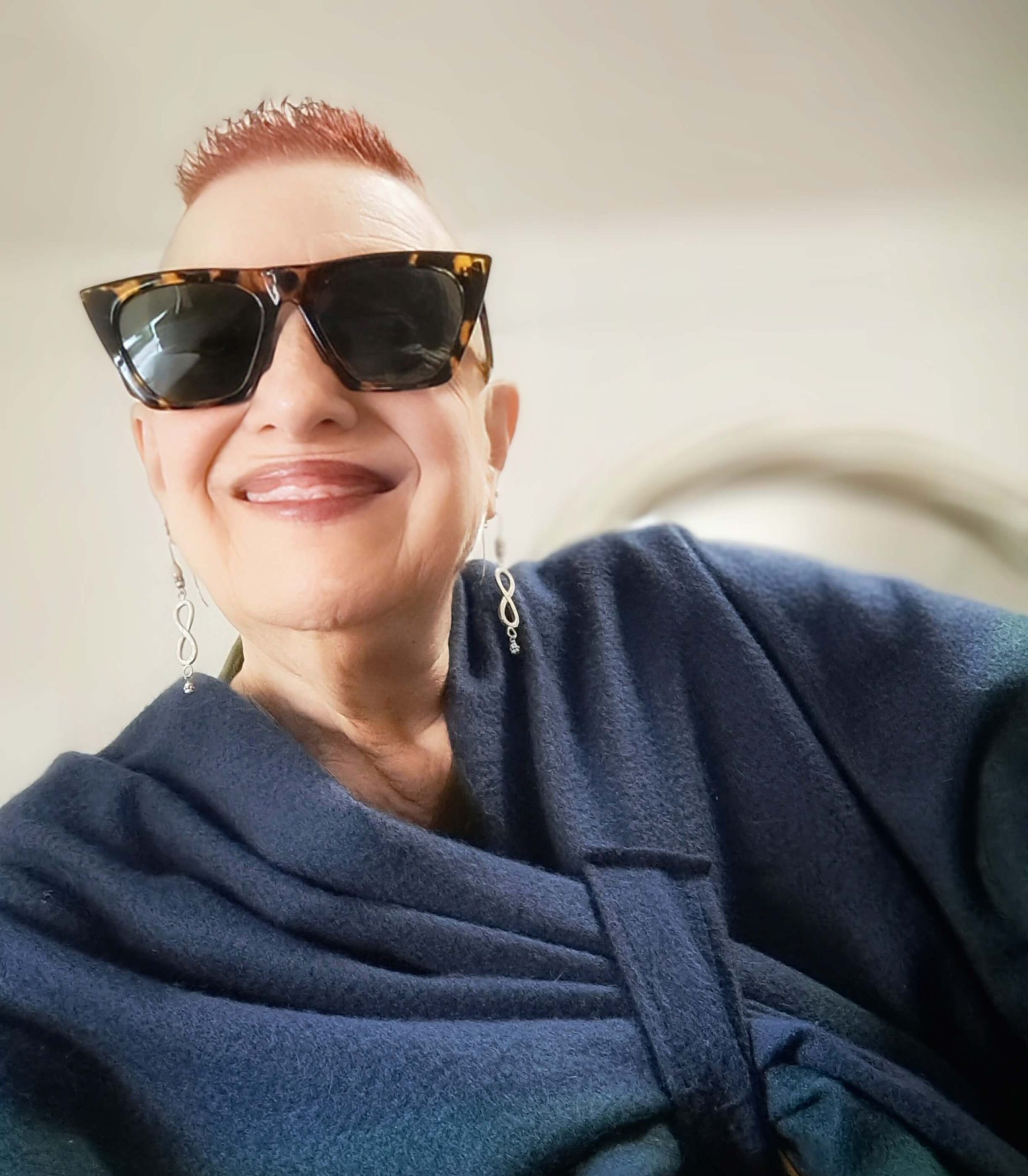 laura wearing blue cape